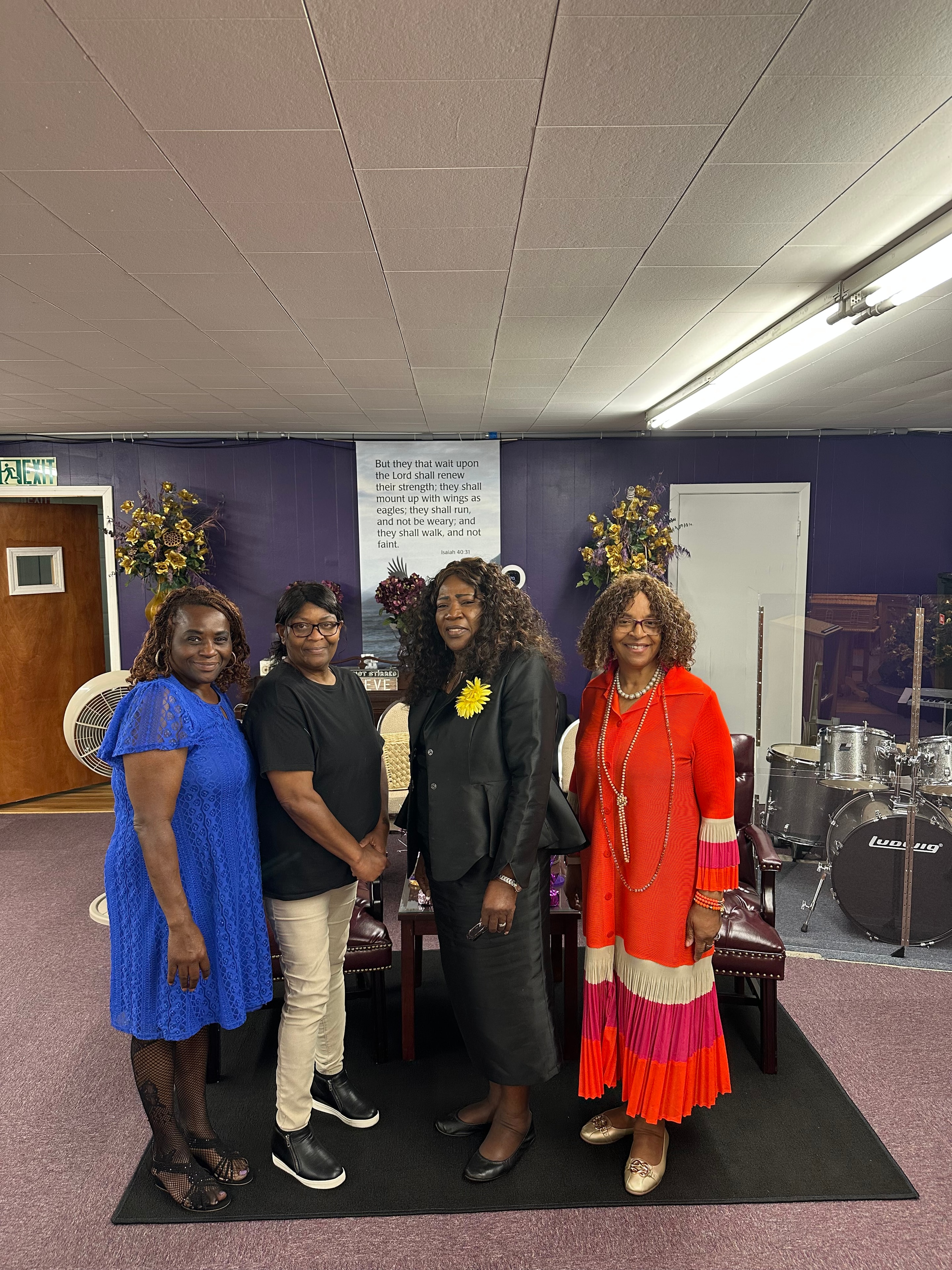 Four women in vibrant outfits at House of Another Chance COGIC