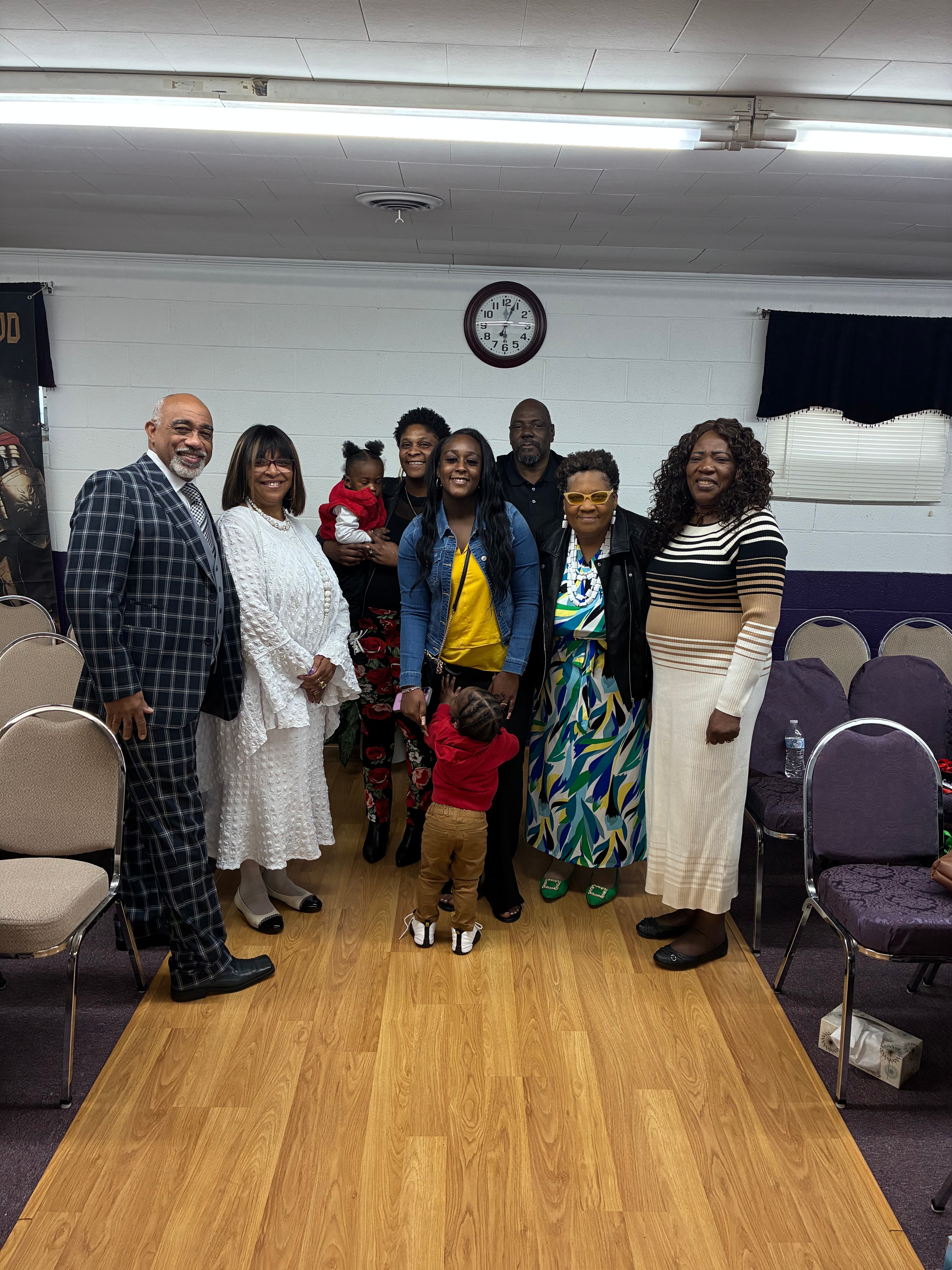 Church family group photo with Pastor and congregation members