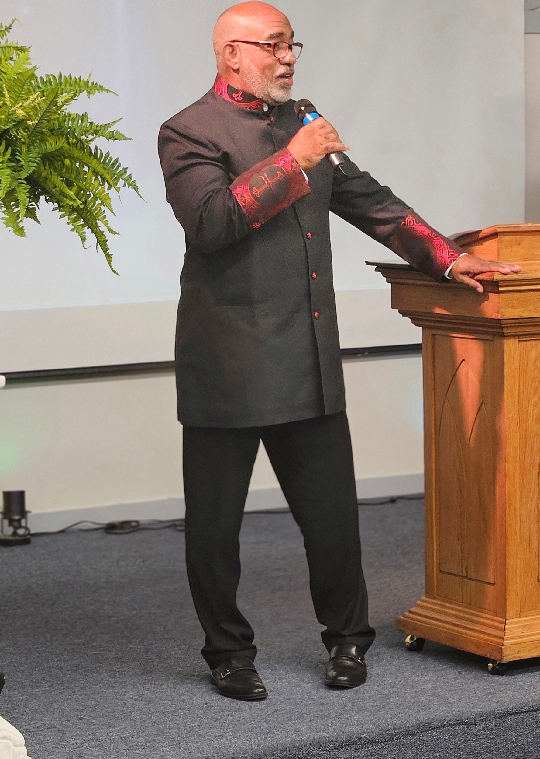 Pastor preaching at the pulpit during Sunday service